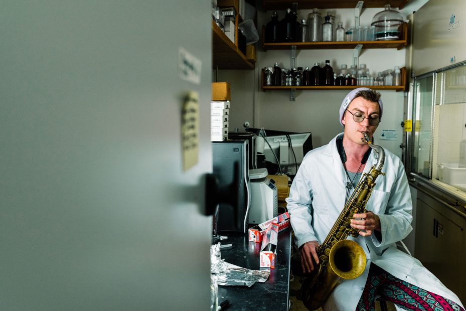 Student plays saxophone in lab